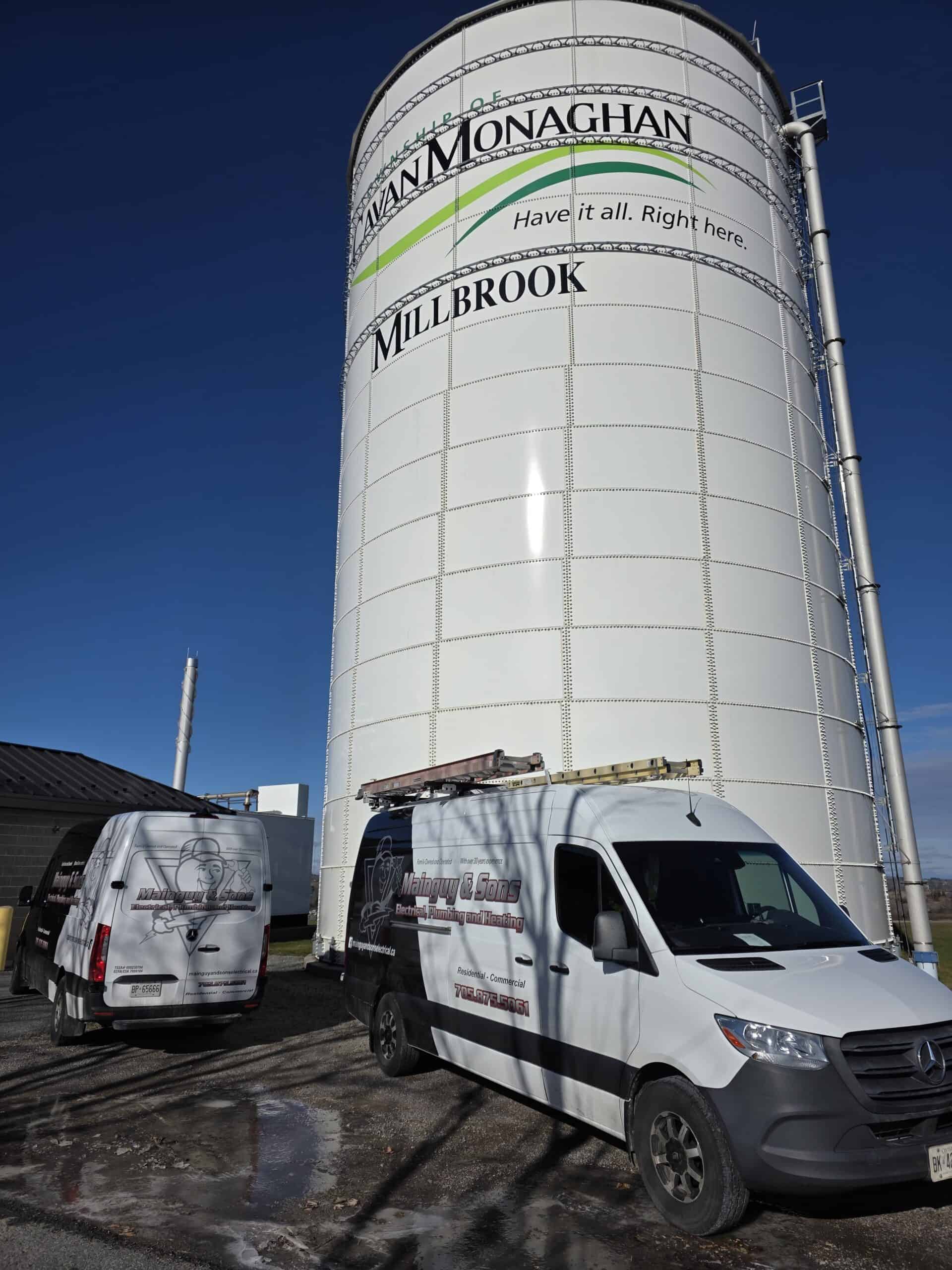 Grain silos at Main Monaghan with company branding.